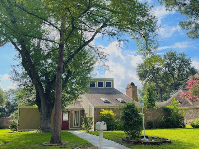 707 Center Hill Dr, Houston, TX 77079 - view of front facade with a front yard, a chimney, and brick siding
