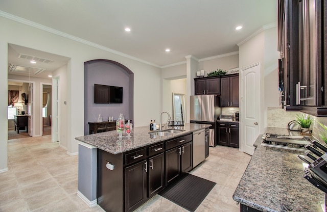 3111 Jane Way, Richmond, TX 77406 - kitchen with a sink, stainless steel appliances, a center island with sink, crown molding, and decorative backsplash