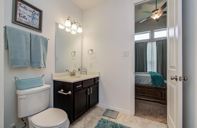 3111 Jane Way, Richmond, TX 77406 - bathroom featuring vanity, toilet, a ceiling fan, connected bathroom, and baseboards