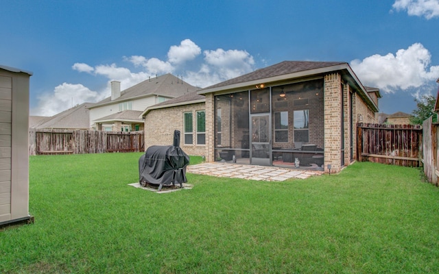 3111 Jane Way, Richmond, TX 77406 - rear view of house featuring brick siding, a sunroom, and a patio