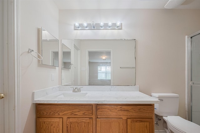 427 Sunset Colony Dr, Rosharon, TX 77583 - full bathroom featuring toilet, vanity, and a shower with shower door