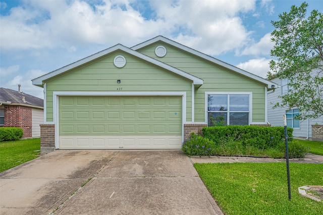 427 Sunset Colony Dr, Rosharon, TX 77583 - ranch-style home featuring brick siding, concrete driveway, a front yard, and a garage