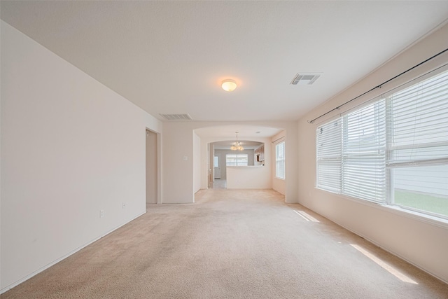 427 Sunset Colony Dr, Rosharon, TX 77583 - unfurnished room featuring light carpet and a chandelier