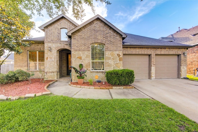 223 Summer Gate Ct, Rosenberg, TX 77469 - french country inspired facade featuring brick siding, a garage, and roof with shingles