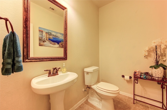 223 Summer Gate Ct, Rosenberg, TX 77469 - bathroom featuring toilet, tile patterned flooring, and baseboards