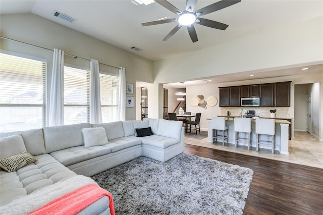 223 Summer Gate Ct, Rosenberg, TX 77469 - living area with lofted ceiling, baseboards, light wood finished floors, and ceiling fan