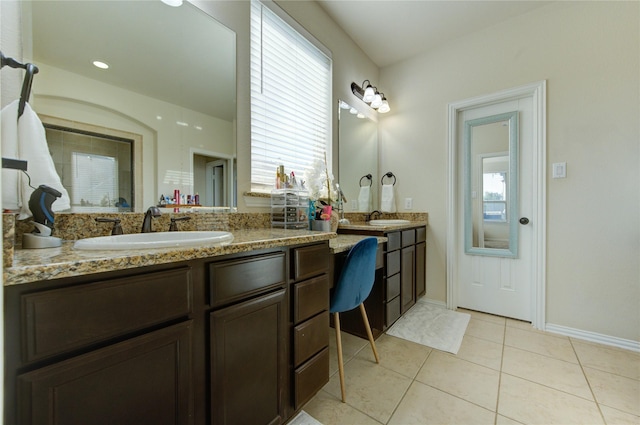 223 Summer Gate Ct, Rosenberg, TX 77469 - full bath featuring double vanity, tile patterned floors, plenty of natural light, and baseboards