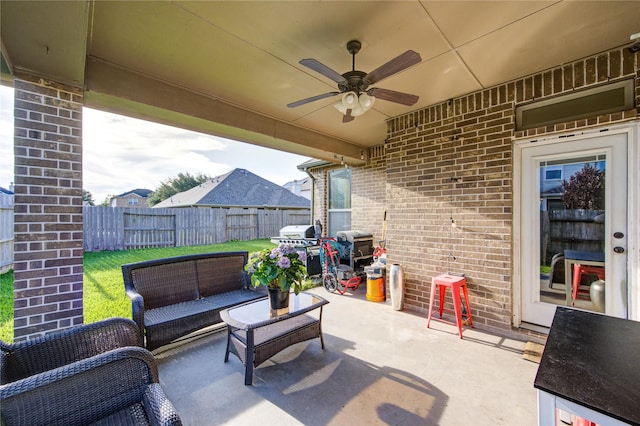 223 Summer Gate Ct, Rosenberg, TX 77469 - fenced backyard with ceiling fan, a patio area, an outdoor hangout area, and area for grilling