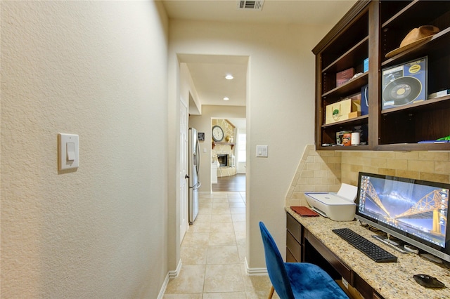 223 Summer Gate Ct, Rosenberg, TX 77469 - office area with light tile patterned floors, a stone fireplace, baseboards, a textured wall, and recessed lighting