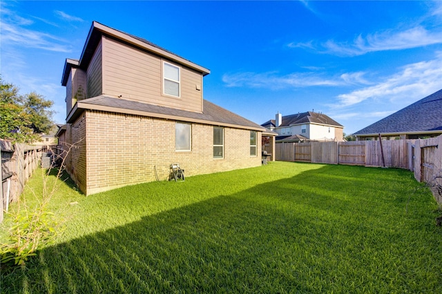 223 Summer Gate Ct, Rosenberg, TX 77469 - rear view of property with brick siding and roof with shingles