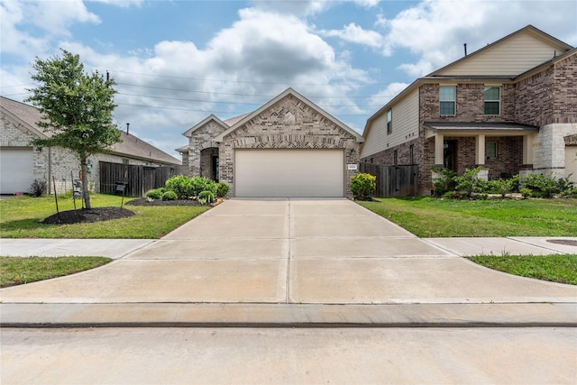 10106 Granite Grove Ln, Richmond, TX 77406 - view of front of home with brick siding, an attached garage, and driveway