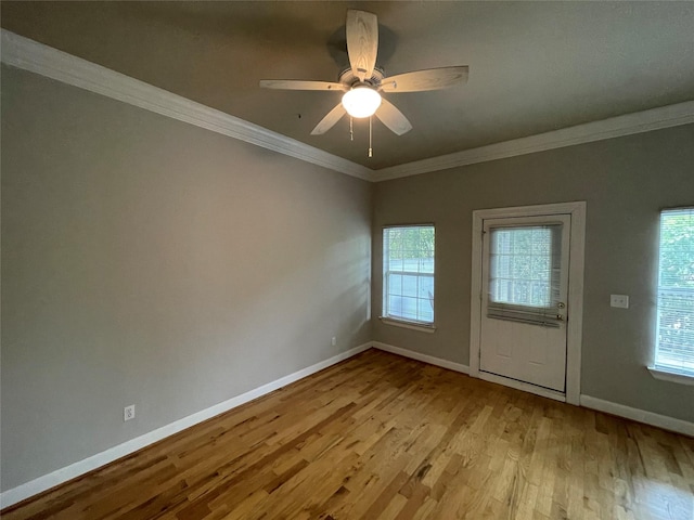 508 W Clay St, Houston, TX 77019 - empty room with light wood finished floors, healthy amount of natural light, baseboards, ornamental molding, and ceiling fan