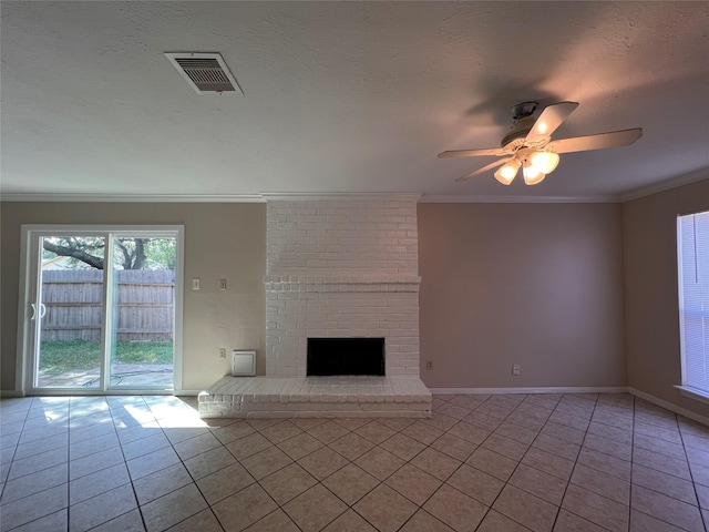 958 Grand Junction Dr, Katy, TX 77450 - unfurnished living room with tile patterned floors, a ceiling fan, a fireplace, crown molding, and baseboards