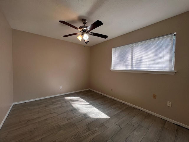 958 Grand Junction Dr, Katy, TX 77450 - spare room featuring wood finished floors, ceiling fan, and baseboards