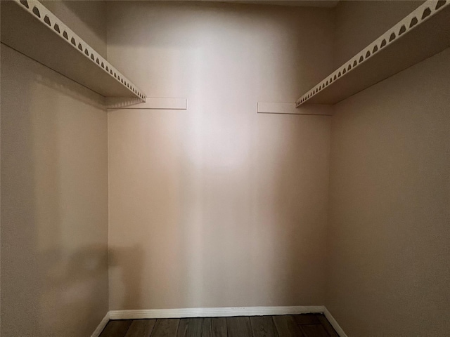 958 Grand Junction Dr, Katy, TX 77450 - walk in closet with dark wood-style flooring