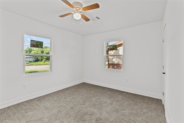 805 19th Ave N, Texas City, TX 77590 - unfurnished room featuring healthy amount of natural light, carpet flooring, and baseboards