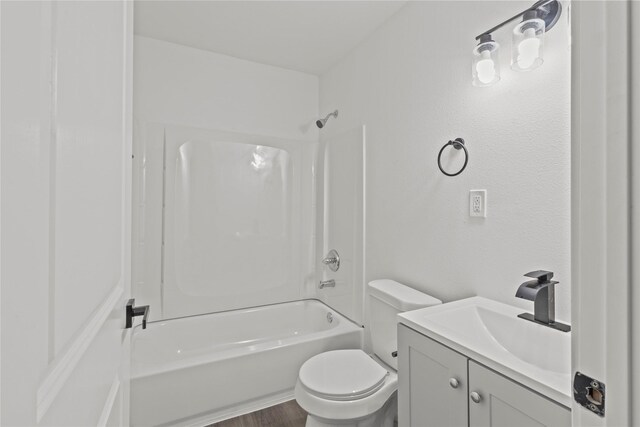805 19th Ave N, Texas City, TX 77590 - full bath with washtub / shower combination, toilet, vanity, and wood finished floors