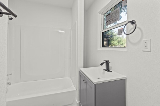 805 19th Ave N, Texas City, TX 77590 - bathroom featuring vanity and washtub / shower combination