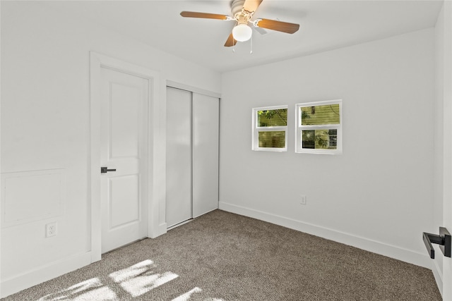 805 19th Ave N, Texas City, TX 77590 - unfurnished bedroom with carpet flooring, a closet, baseboards, and ceiling fan