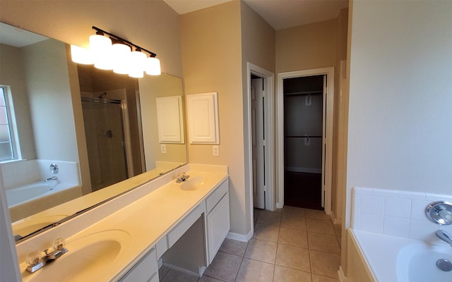 2707 Sun Beam Ct, Pearland, TX 77584 - full bath with a stall shower, a garden tub, double vanity, tile patterned floors, and a walk in closet