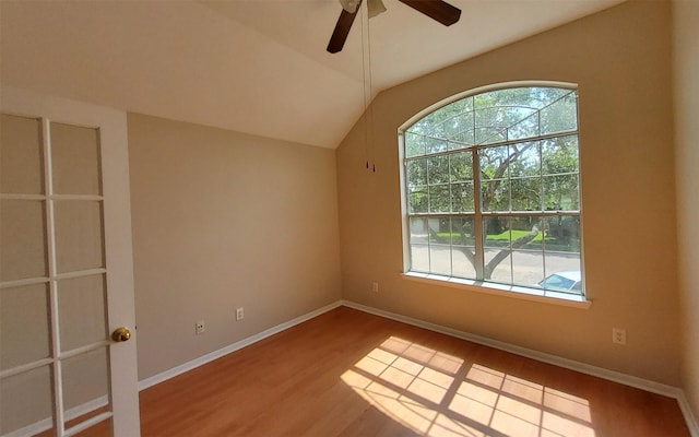 2707 Sun Beam Ct, Pearland, TX 77584 - unfurnished room with wood finished floors, a ceiling fan, lofted ceiling, and baseboards