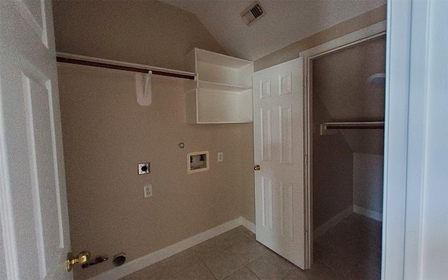 2707 Sun Beam Ct, Pearland, TX 77584 - laundry area featuring gas dryer hookup, tile patterned floors, hookup for a washing machine, electric dryer hookup, and baseboards