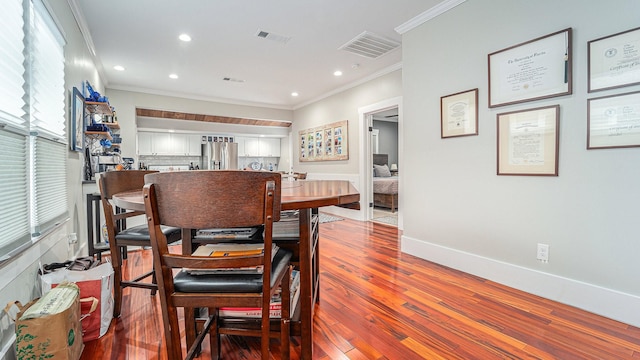 405 N Grace St N, Houston, TX 77003 - dining area featuring crown molding, wood finished floors, recessed lighting, and baseboards