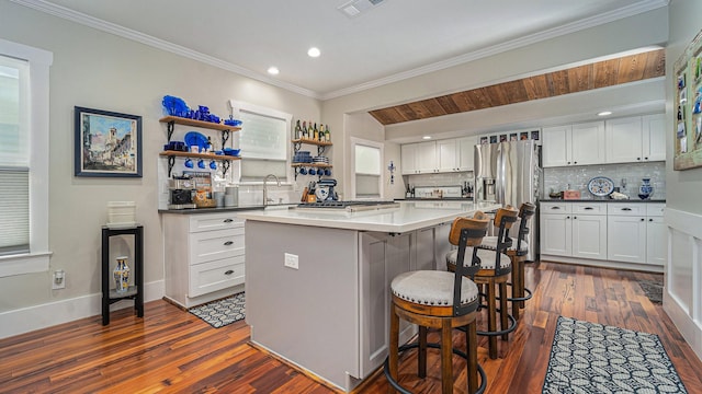 405 N Grace St N, Houston, TX 77003 - kitchen with tasteful backsplash, dark wood-style flooring, stainless steel fridge with ice dispenser, ornamental molding, and recessed lighting