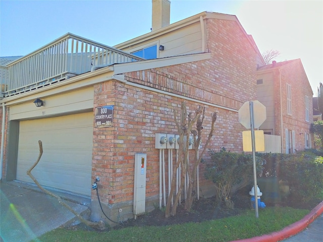 800 Country Place Dr Unit 909, Houston, TX 77079 - view of property exterior featuring brick siding and a chimney