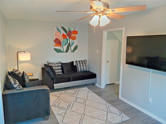 800 Country Place Dr Unit 909, Houston, TX 77079 - living area featuring a ceiling fan, wood finished floors, and baseboards