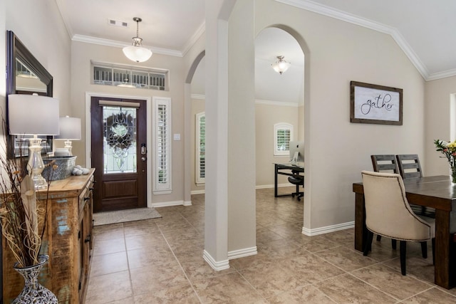 23118 Mestina Knoll Dr, Porter, TX 77365 - foyer featuring arched walkways, crown molding, light tile patterned floors, and baseboards