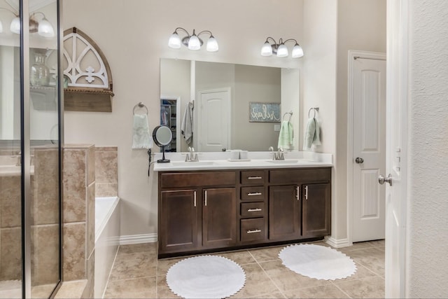 23118 Mestina Knoll Dr, Porter, TX 77365 - full bath with a bath, tile patterned floors, double vanity, and baseboards