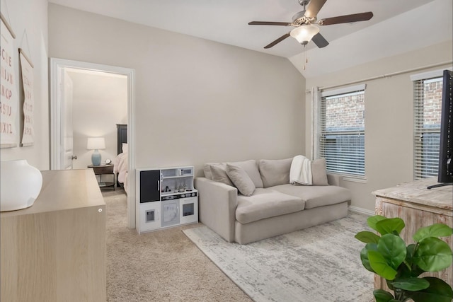 23118 Mestina Knoll Dr, Porter, TX 77365 - living area featuring light carpet, a ceiling fan, lofted ceiling, and baseboards