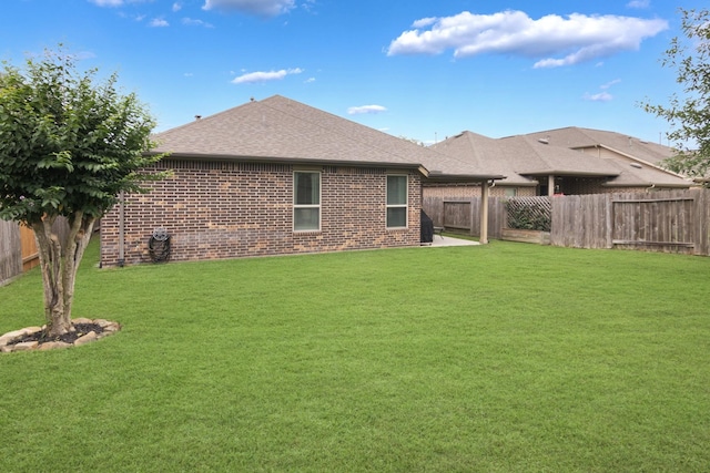 23118 Mestina Knoll Dr, Porter, TX 77365 - back of property with brick siding, roof with shingles, and a patio