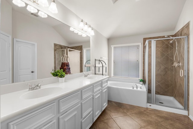 31870 Forest Park Trl, Conroe, TX 77385 - bathroom featuring vaulted ceiling, double vanity, a garden tub, a stall shower, and tile patterned floors