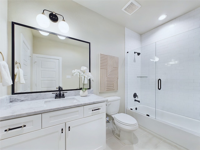 5020 Broom St, Houston, TX 77091 - full bathroom featuring tile patterned flooring, toilet, shower / bath combination with glass door, and vanity