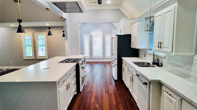 53 S Calla Lily Ct, Lake Jackson, TX 77566 - kitchen with range with two ovens, dishwasher, a chandelier, dark wood finished floors, and plenty of natural light