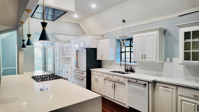 53 S Calla Lily Ct, Lake Jackson, TX 77566 - kitchen featuring a sink, white appliances, vaulted ceiling, tasteful backsplash, and white cabinetry