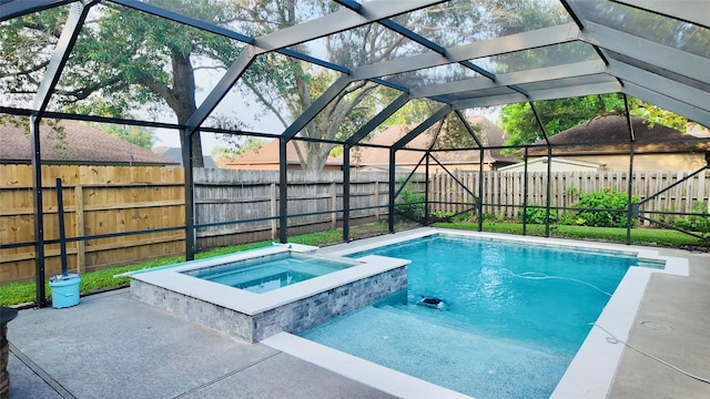 53 S Calla Lily Ct, Lake Jackson, TX 77566 - view of pool with a fenced backyard, a lanai, and a pool with connected hot tub