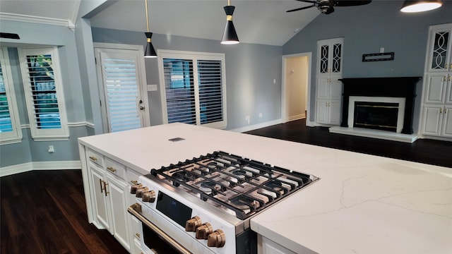53 S Calla Lily Ct, Lake Jackson, TX 77566 - kitchen with gas stove, lofted ceiling, baseboards, a ceiling fan, and white cabinets