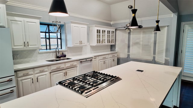 53 S Calla Lily Ct, Lake Jackson, TX 77566 - kitchen with a sink, stainless steel dishwasher, white cabinets, backsplash, and gas cooktop