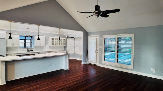 53 S Calla Lily Ct, Lake Jackson, TX 77566 - kitchen featuring a sink, a ceiling fan, light countertops, dark wood finished floors, and white cabinetry