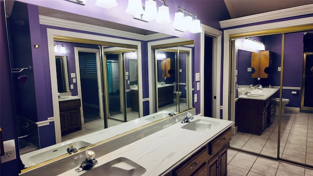 53 S Calla Lily Ct, Lake Jackson, TX 77566 - full bathroom with vanity, tile patterned floors, toilet, crown molding, and a chandelier