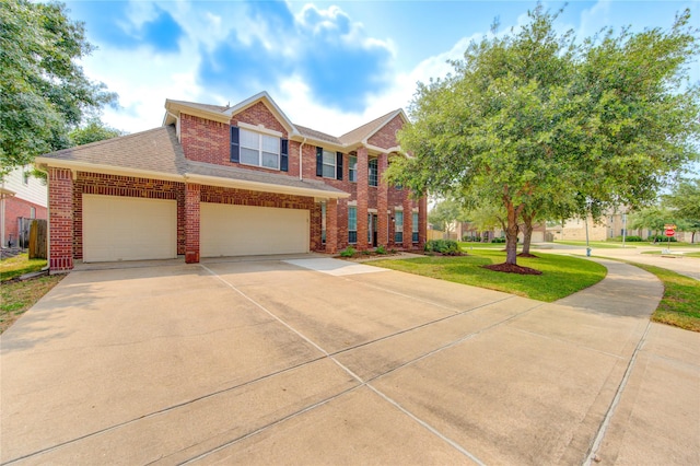 5015 Shale Grove Ct, Richmond, TX 77407 - view of property featuring brick siding, concrete driveway, a front lawn, and roof with shingles