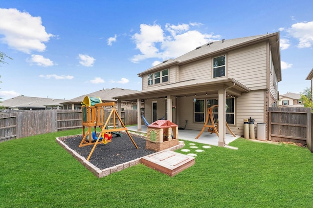 1164 Clonmore Ct, Conroe, TX 77304 - rear view of house with a playground and a patio