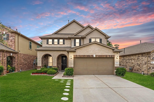 1164 Clonmore Ct, Conroe, TX 77304 - view of front of house with driveway, a yard, an attached garage, and stone siding