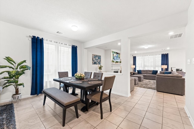 1164 Clonmore Ct, Conroe, TX 77304 - dining space with light tile patterned flooring and baseboards