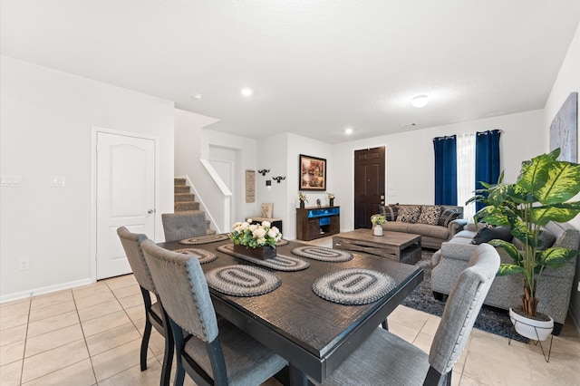 1164 Clonmore Ct, Conroe, TX 77304 - dining room featuring stairs, light tile patterned floors, recessed lighting, and baseboards