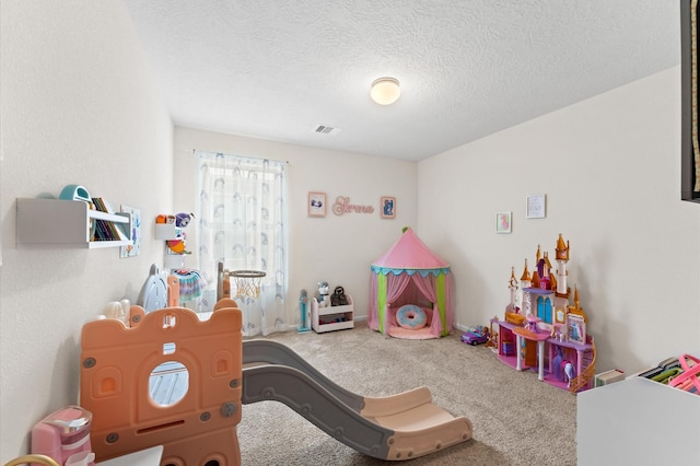 1164 Clonmore Ct, Conroe, TX 77304 - playroom featuring carpet flooring and a textured ceiling