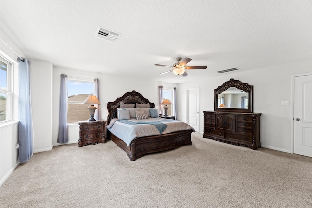 1164 Clonmore Ct, Conroe, TX 77304 - bedroom with carpet floors, ceiling fan, baseboards, and a textured ceiling